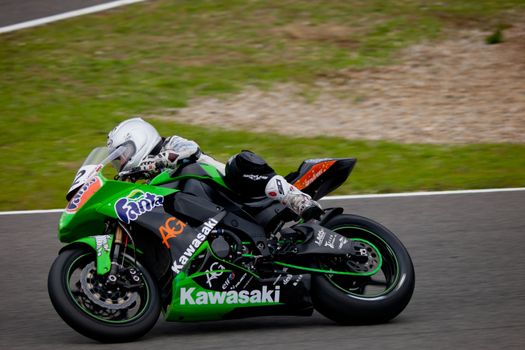 JEREZ DE LA FRONTERA, SPAIN - NOV 20: Stock Extreme motorcyclist Elena Rosell takes a curve in the CEV championship on Nov 20, 2010, in Jerez de la Frontera, Spain