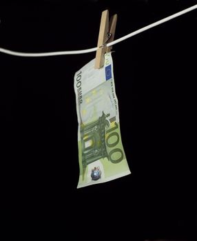 Laundering money towards black background