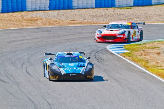 JEREZ DE LA FRONTERA, SPAIN - OCT 16: Ferran Monje(4) followed by Francesc Gutierrez(42)races on Iber GT championship on October 16 , 2011, in Jerez de la Frontera , Spain