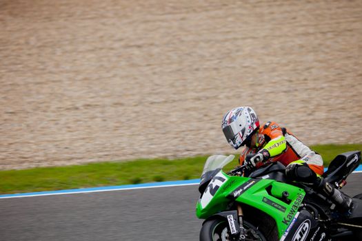 JEREZ DE LA FRONTERA, SPAIN - NOV 20: Stock Extreme motorcyclist Oscar Ibañez takes a curve in the CEV championship on Nov 20, 2010, in Jerez de la Frontera, Spain