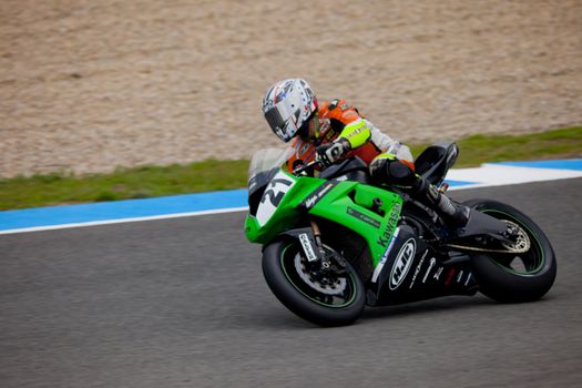 JEREZ DE LA FRONTERA, SPAIN - NOV 20: Stock Extreme motorcyclist Oscar Ibañez takes a curve in the CEV championship on Nov 20, 2010, in Jerez de la Frontera, Spain