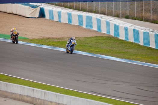 JEREZ DE LA FRONTERA, SPAIN - NOV 20: MOTO2 motorcyclists Axel Pons and Ivan Silva races in the CEV championship on Nov 20, 2010, in Jerez de la Frontera, Spain