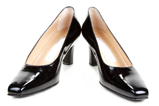 Black feminine varnished loafers on white background