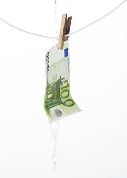 Laundering money towards white background