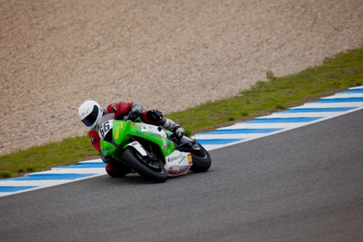 JEREZ DE LA FRONTERA, SPAIN - NOV 20: Stock Extreme motorcyclist Andres Aparicio takes a curve in the CEV championship on Nov 20, 2010, in Jerez de la Frontera, Spain