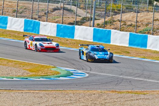 JEREZ DE LA FRONTERA, SPAIN - OCT 16: Ferran Monje(4) followed by Francesc Gutierrez(42)races on Iber GT championship on October 16 , 2011, in Jerez de la Frontera , Spain
