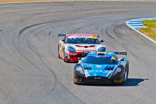 JEREZ DE LA FRONTERA, SPAIN - OCT 16: Ferran Monje(4) followed by Francesc Gutierrez(42)races on Iber GT championship on October 16 , 2011, in Jerez de la Frontera , Spain