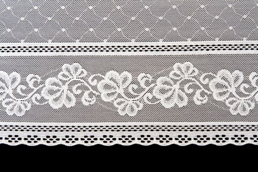 Decorative white lace on insulated black background