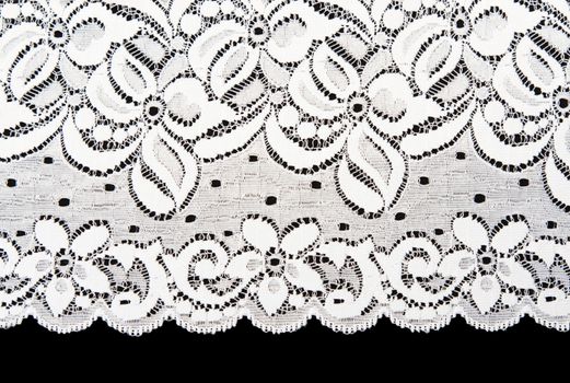 Decorative white lace on insulated black background