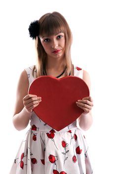 Beautiful girl in gown with red colour and heart in hand on white background