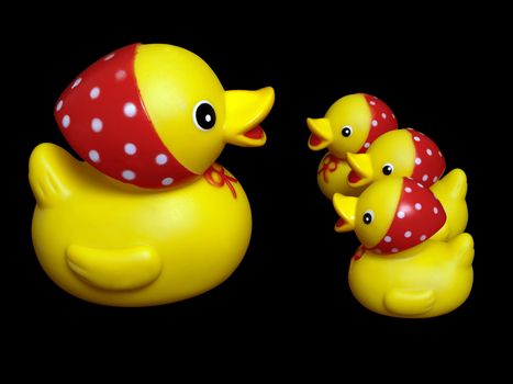 Yellow rubber mother duck toy and child isolated