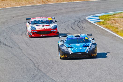 JEREZ DE LA FRONTERA, SPAIN - OCT 16: Ferran Monje(4) followed by Francesc Gutierrez(42)races on Iber GT championship on October 16 , 2011, in Jerez de la Frontera , Spain