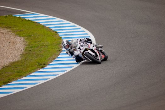 JEREZ DE LA FRONTERA, SPAIN - NOV 20: Stock Extreme motorcyclist Enrique Rocamora takes a curve in the CEV championship on Nov 20, 2010, in Jerez de la Frontera, Spain
