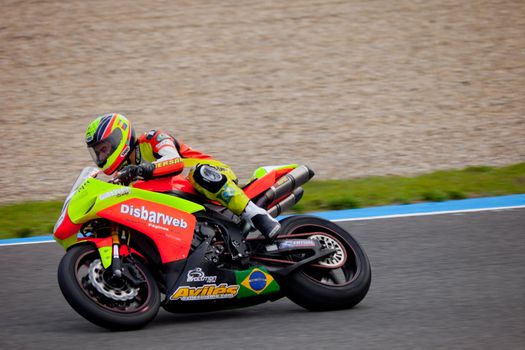 JEREZ DE LA FRONTERA, SPAIN - NOV 20: Stock Extreme motorcyclist Jose Gomez takes a curve in the CEV championship on Nov 20, 2010, in Jerez de la Frontera, Spain