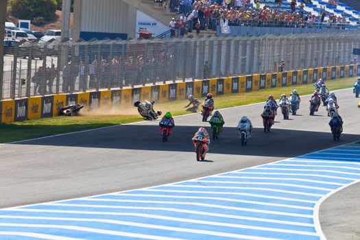 JEREZ DE LA FRONTERA, SPAIN - APR 17: Motorbike competitors begin the uneven 125cc race in the CEV Championship on April 17, 2011 in Jerez de la Frontera, Spain.