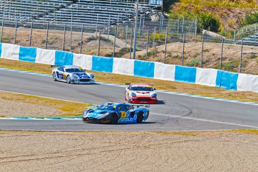 JEREZ DE LA FRONTERA, SPAIN - OCT 16: Ferran Monje(4) followed by Francesc Gutierrez(42) and Pedro Lopes(44) races on Iber GT championship on October 16 , 2011, in Jerez de la Frontera , Spain