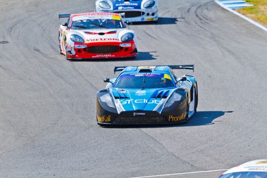 JEREZ DE LA FRONTERA, SPAIN - OCT 16: Ferran Monje(4) followed by Francesc Gutierrez(42) and Pedro Lopes(44) races on Iber GT championship on October 16 , 2011, in Jerez de la Frontera , Spain