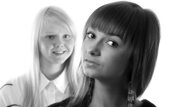 Portrait two girls small depth to sharpnesses on white background monochrome