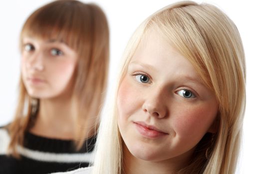 Portrait two girls small depth to sharpnesses on white background