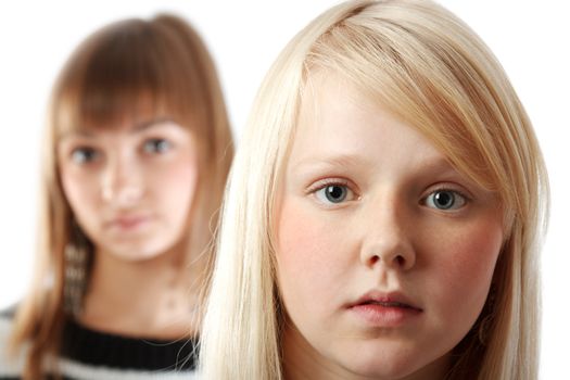 Portrait two girls small depth to sharpnesses on white background