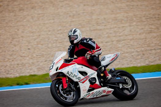 JEREZ DE LA FRONTERA, SPAIN - NOV 20: Stock Extreme motorcyclist Diego Lopez takes a curve in the CEV championship on Nov 20, 2010, in Jerez de la Frontera, Spain