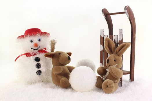 Snowman and stuffed animals for winter fun