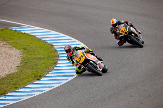 JEREZ DE LA FRONTERA, SPAIN - NOV 20: MOTO2 motorcyclist Carmelo Morales and Alejandro Martinez takes a curve in the CEV championship on Nov 20, 2010, in Jerez de la Frontera, Spain