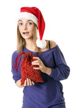 Beautiful girl in red Santa hat on a white background