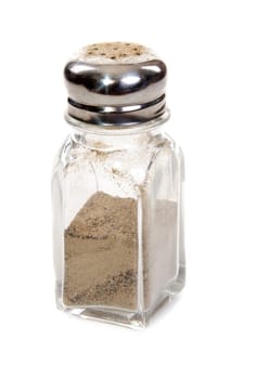 Glass pepper shaker insulated on white background