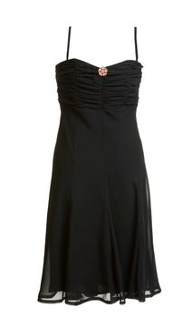 Black evening satin gown with brooch on white background