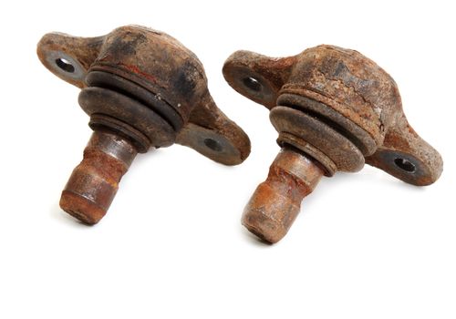 Rusty spare part of the car on white background