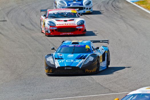 JEREZ DE LA FRONTERA, SPAIN - OCT 16: Ferran Monje(4) followed by Francesc Gutierrez(42) and Pedro Lopes(44) races on Iber GT championship on October 16 , 2011, in Jerez de la Frontera , Spain