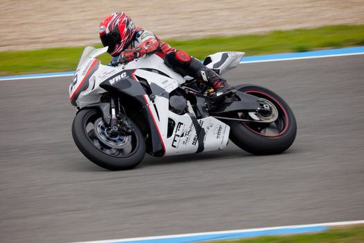 JEREZ DE LA FRONTERA, SPAIN - NOV 20: Stock Extreme motorcyclist Adrian Gandara takes a curve in the CEV championship on Nov 20, 2010, in Jerez de la Frontera, Spain