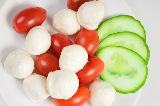 Diet salad with cherry tomatoes and mozzarella.