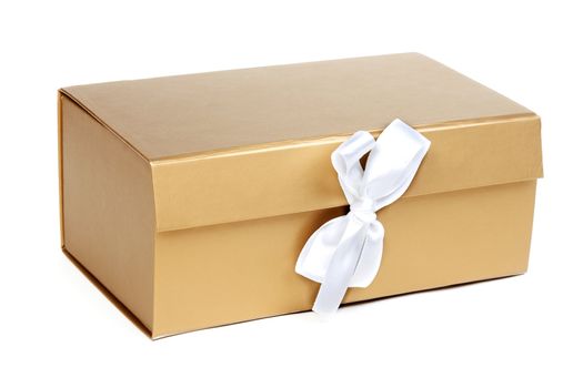 Golden gift box with a bow on a white background