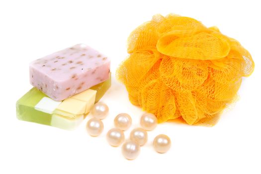 Green, purple and yellow fruit soap washcloth on white background