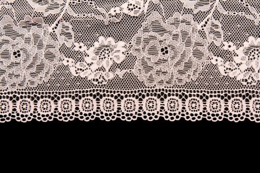 Pink lace with a floral pattern on a black background