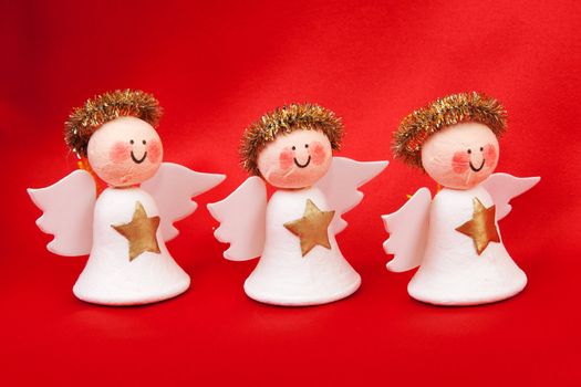 Decorative angel from a set scrapbooking on a red background