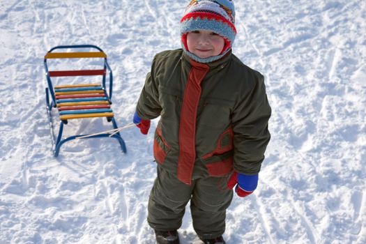 Little child fun winter outdoor snow sport sled