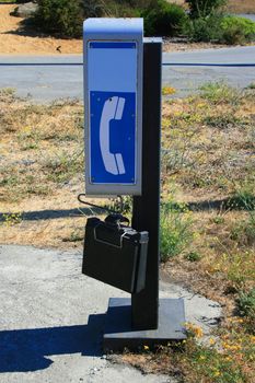 Close up of a phone booth in a park.
