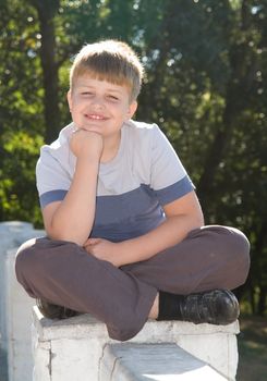Portrait of a boy with a pleased smile upon one's face