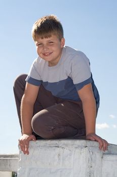 Portrait of a boy with a pleased smile upon one's face