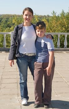 Mum and the son in summer park.