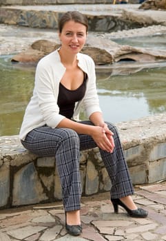 portrait of a beautiful woman in summer park