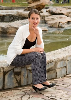 portrait of a beautiful woman in summer park