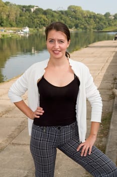 portrait of a beautiful woman with river at background