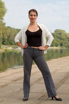 portrait of a beautiful woman with river at background