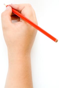Children's hand with a pencil on a white background