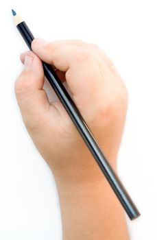 Children's hand with a pencil on a white background