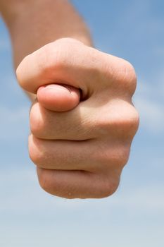 fig. Human hand on a blue sky